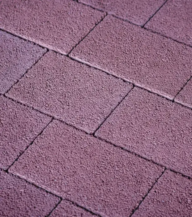 Textured concrete paving surface with neat rectangular block pattern